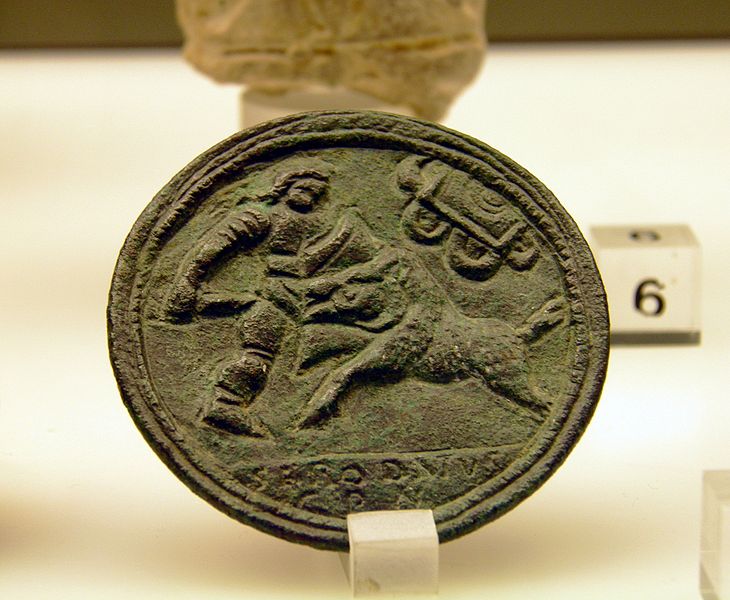 File:Bronze medallion depicting the fight between a Venatio and a wild animal, Romisch-Germanisches Museum, Cologne (8119443997).jpg