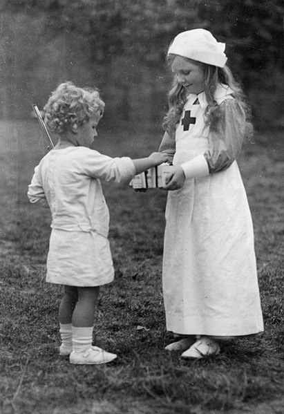 File:Children-playing-a-nurse-during-First-World-War-142355231082.jpg