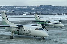 Two DHC Dash-8-100 aircraft of Wideroe of Norway at Trondheim Airport, Vaernes. Wideroe makes a large portion of its revenue from PSO routes like these in Northern and Western Norway. Dash 8.jpg