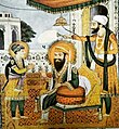 Guru Arjan (seated, middle) with a young Hargobind (left).