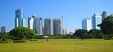 Haikou, the capital of the province as seen looking south from Evergreen Park, a large park located on the north shore of the city Haikou skyline 2 - 2009 09 07.jpg