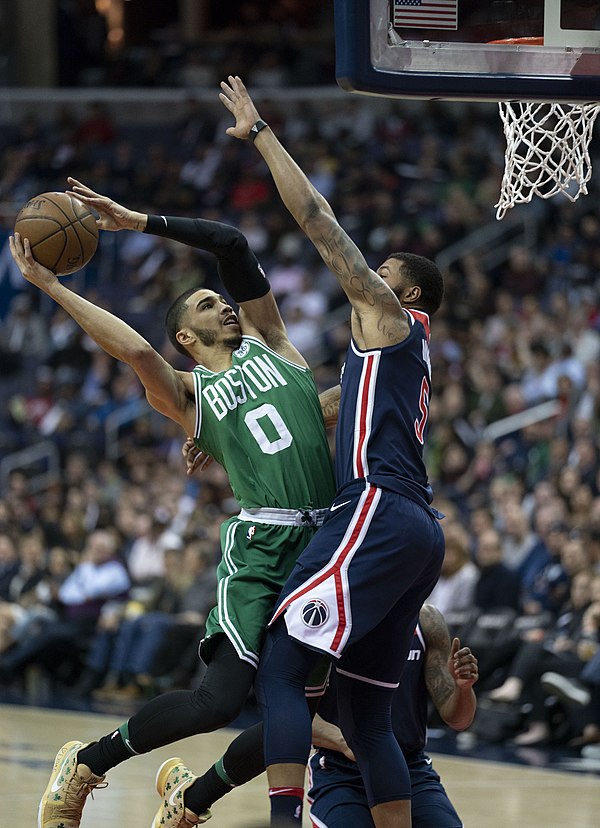 Tatum (left) attempting a shot against the Washington Wizards in 2018