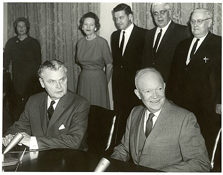 Diefenbaker (seated left) and US President Dwight D. Eisenhower at the signing of the Columbia River Treaty, 1961.