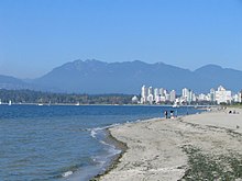 Kitsilano Beach with the West End, Stanley Park and the North Shore Mountains in the distance