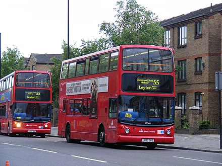 Two buses together on the same route