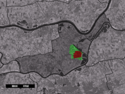 The town centre (red) and the statistical district (light green) of Kerkdriel in the municipality of Maasdriel.