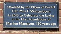 Inscription: Unveiled by the Mayor of Bexhill Cllr Mrs F Winterborn in 2013 to Celebrate the Laying of the First Foundations of Marine Mansions 120 years ago.