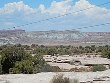 Bluish beds of the Brushy Basin Member containing alkali minerals deposited in Lake T'oo'dichi' Morrison Formation near Arches.jpg