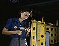 "Operating_a_hand_drill_this_woman_worker_is_shown_working_on_the_horizontal_stabilizer.jpg" by User:Jan Arkesteijn