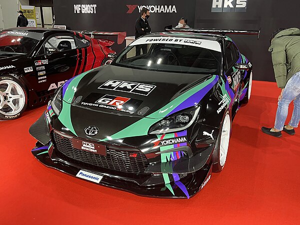 HKS Toyota GR86 with the HKS "Oil Slick" livery at the 2022 Osaka Auto Messe