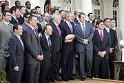 President George W. Bush poses with the New England Patriots during a ceremony honoring the 2004 Super Bowl Champions in the Rose Garden (13 April 2005)