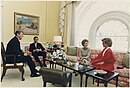 The Reagans have tea with Prince Charles and Princess Diana.