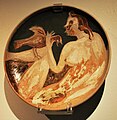 Stoneware plate with woman and bird design by Francisco Toledo on display at the Museum of Artes Populares in Mexico City