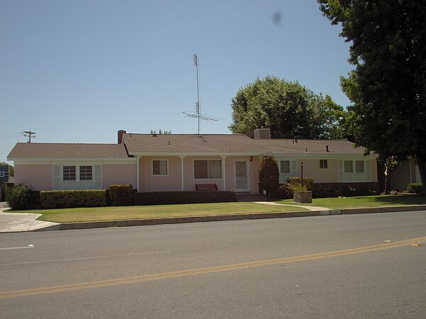 California ranch house with evaporative cooler box on roof ridgeline on right