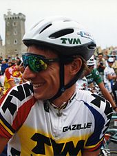 A picture of a cyclist wearing a helmet.
