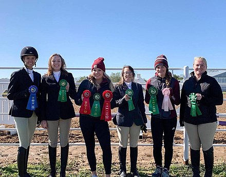 The Equestrian Team displaying medals
