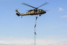 Commandos fast rope from a 171st Aviation Squadron Blackhawk helicopter during Exercise Talisman Sabre in 2015 Soldiers from the Australian Army 2nd Commando Regiment fast rope from an S-70A-9 Black Hawk from the Australian Army 171st Aviation Squadron during exercise Talisman Sabre 2015.jpg