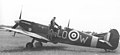 'Paddy' Finucane on top of his Spitfire Mk Vb (BM124) LO-W, "QUEEN of SALOTE", while in command of No.602 Squadron at RAF Redhill, early 1942.