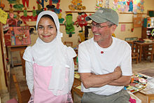 Bilheimer with a student at a mixed-sex school in Egypt. Bilheimer removed much of the related content from the film after the Arab Spring made the information outdated. Student and Robert Bilheimer.jpg