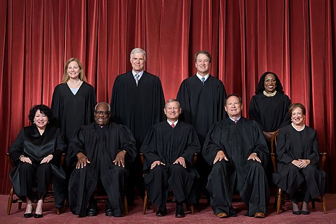 The Roberts Court (since June 2022): Front row (left to right): Sonia Sotomayor, Clarence Thomas, Chief Justice John Roberts, Samuel Alito, and Elena Kagan. Back row (left to right): Amy Coney Barrett, Neil Gorsuch, Brett Kavanaugh, and Ketanji Brown Jackson.