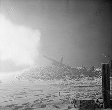 5.5-inch guns of 236 Bty, 59th Medium Rgt, firing at dawn before XII Corps' attack at Sittard, 16 January 1945. The Campaign in North West Europe 1944-45 B13744.jpg