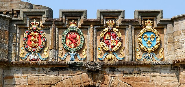 The four European orders of chivalry to which James V belonged — Garter, Thistle, Golden Fleece and St Michael — on the outer gate he built at his bir