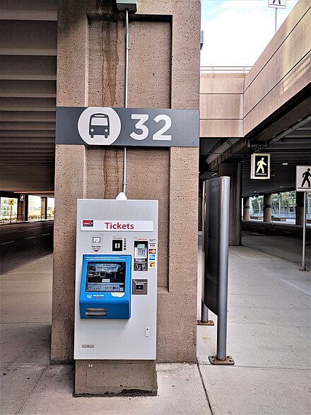 Ticket dispenser at bus bay 32. Coins, debit, or credit accepted.