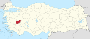 Uşak highlighted in red on a beige political map of Turkeym