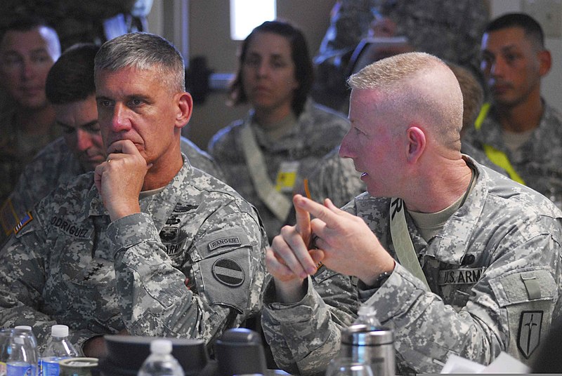 File:U.S. Army Gen. David M. Rodriguez, left, the commander of Army Forces Command, listens to Col. Bret Van Camp, the commander of the 1st Maneuver Enhancement Brigade, during a briefing for exercise Vibrant 120731-A-ZZ999-304.jpg