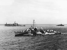 The invasion fleet en route to Saipan on 12 June, including the destroyer Kidd (foreground), Tennessee (center left) and an unidentified escort carrier (background) and another destroyer USS Kidd (DD-661) underway off Roi on 12 June 1944.jpg