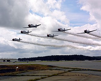 The Skytypers performing in 2004 US Navy 040925-N-4459K-016 The Skytypers Air Show Team fly down the runway in formation at the 2004 Naval Air Station Oceana Air Show.jpg