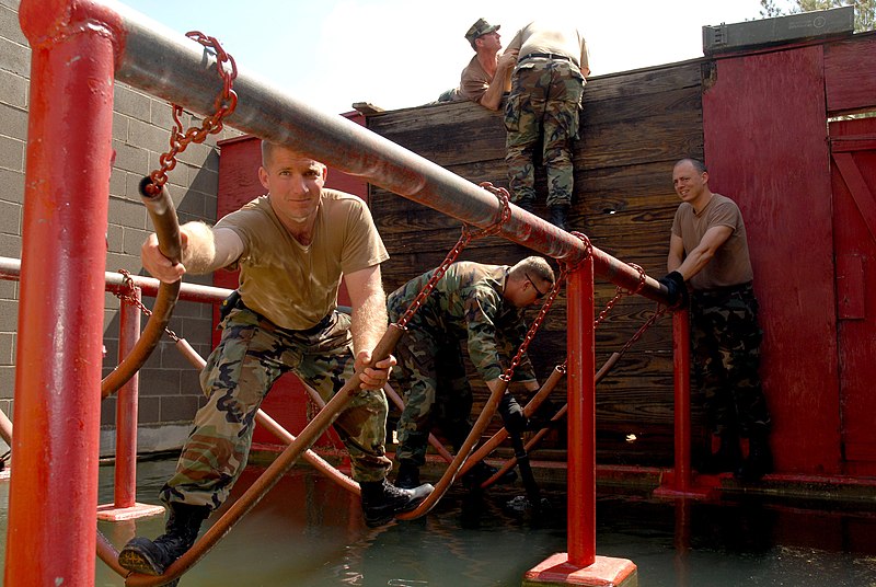 File:US Navy 070426-N-0553R-009 Lt. Luke Greene, of Naval Mobile Construction Battalion (NMCB) 1, leads his team through an obstacle at the Leadership Reaction Course.jpg