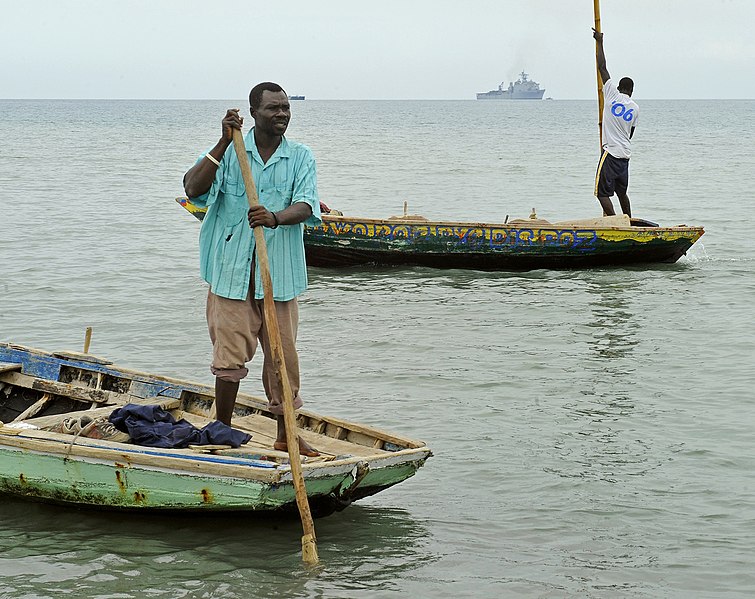 File:US Navy 100119-N-5345W-124 Haitian fishermen navigate their boats away from the designated landing area as U.S. Navy and Marine Corps relief forces prepare to bring landing craft.jpg