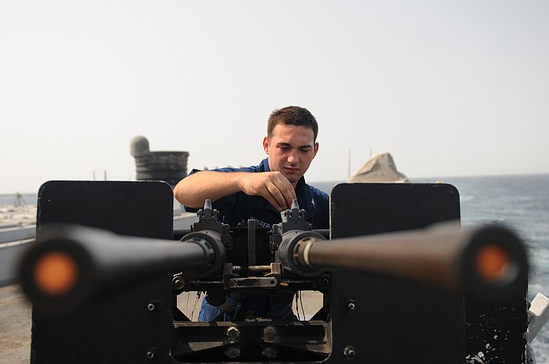 File:US Navy 111006-N-XQ375-033 Fire Controlman 3rd Class Dustyn Walker performs maintenance on a .50-caliber machine gun.jpg