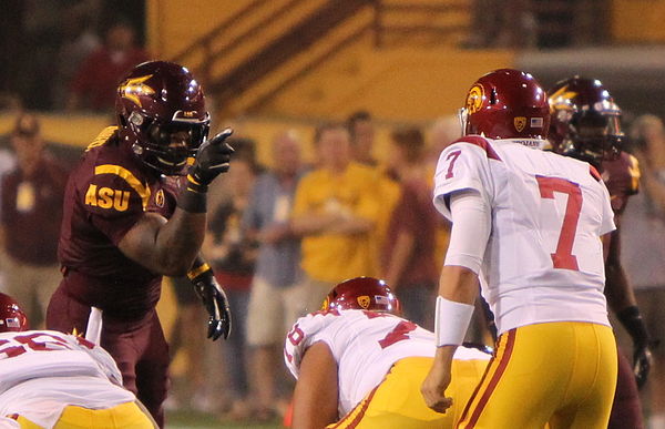 Burfict (left) pointing at USC Trojans quarterback Matt Barkley in 2011