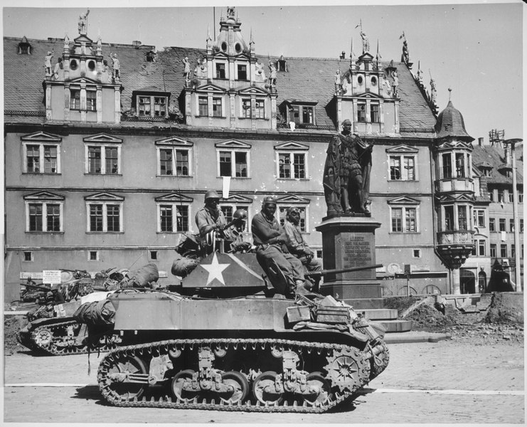 File:"Crews of U.S. light tanks stand by awaiting call to clean out scattered Nazi machine gun nests in Coburg, Germany.", 04 - NARA - 535534.tif
