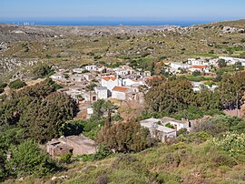 The village, situated below the crest of a ridge, photographer looking north to the sea of Crete from a high point of the Zakros mountains.