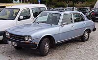 US-market Saloon with bigger bumpers, sealed-beam headlamps, and side marker lights