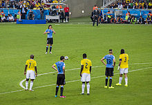 Cavani waiting to take a free-kick in the Round of 16 game against Colombia at the 2014 World Cup