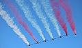 The air formation patrulla águila trying to present the colors of the Spanish flag