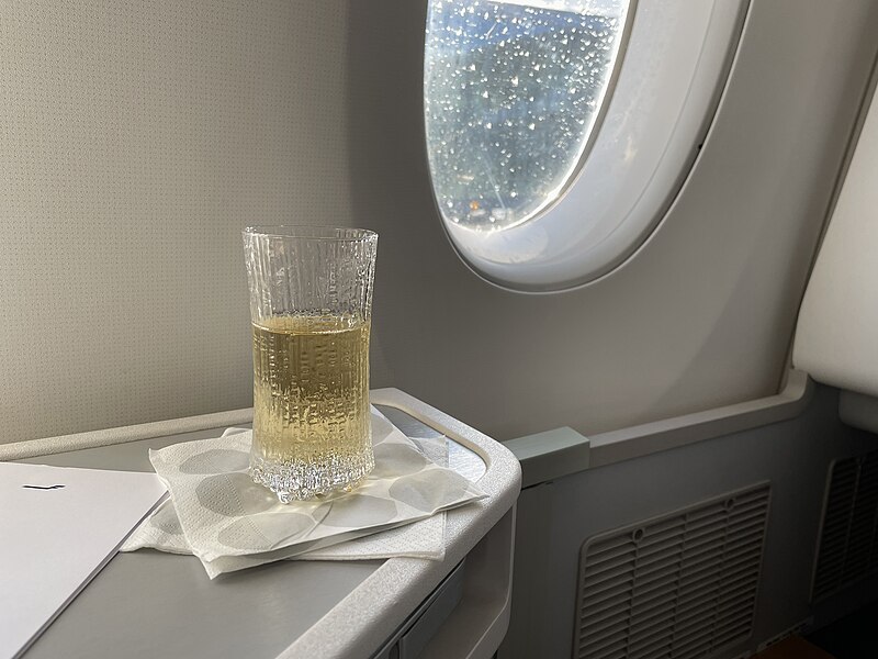 File:A glass of Champagne in old Finnair Business Class.jpg