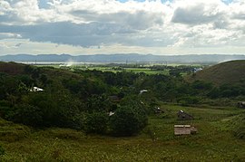 A view of native houses in Bula pecuaria green hills WTR.JPG