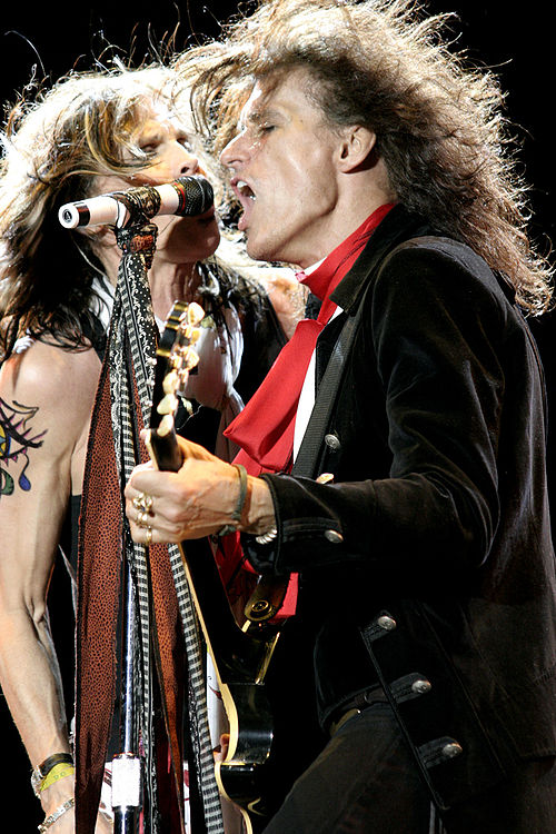 Steven Tyler and Joe Perry performing live in concert