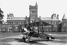 A Sopwith Camel aircraft rests on the Front Campus lawn in 1918. AirplaneInFrontOfUC.jpg