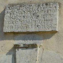 A Latin inscription dated 1691 over the door of the Church