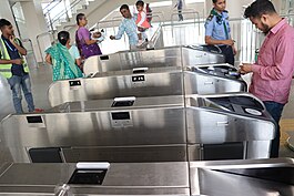 A passenger is using MRT Pass at a Dhaka Metro Rail station Autimated entryway at Agargaon metro station 7.jpg