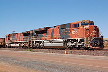 BHP Billiton Iron Ore GE CM40-8M no. 5650 Yawata (left) and EMD SD70ACe no. 4352 Lightning (right) at Boodarie, near Port Hedland, 2012. BHPB Iron Ore 5650 + 4352 (2).JPG