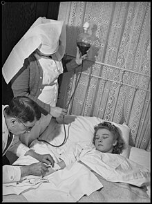 Woman receiving blood donation, Sydney, Australia, 1940 Blood Donation 1940 SLNSW FL9670804.jpg