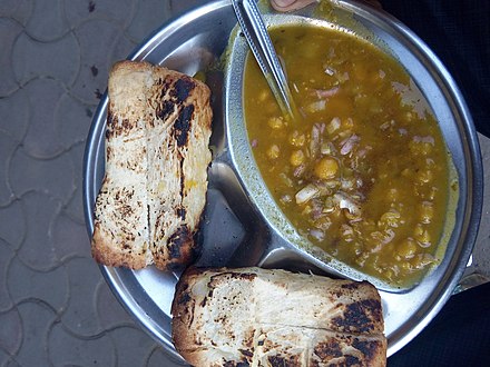 Ghugni with bread, popular as breakfast in Kolkata, West Bengal.
