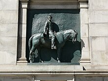 A bas-relief of Abraham Lincoln on horseback, located within the archway opening